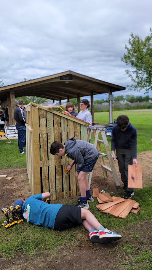 Troop members working together on a service project.
